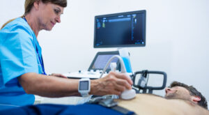 Man getting ultrasound of a abdomen from doctor